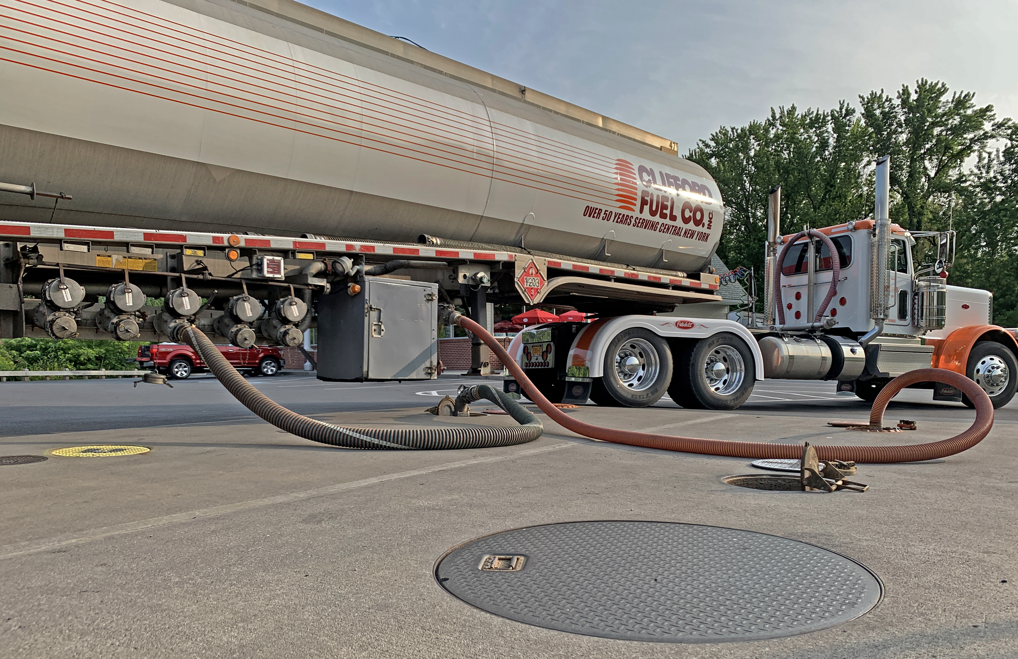 clifford fuel truck delivering fuel to gas station